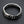 Side view of 11mm wide men's silver curb chain bracelet showing link thickness and mirror shine