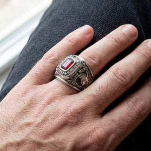 1952 championship sterling silver ring with a red rectangular stone and Spartan side detail worn on a man's hand