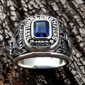 Close-up of the vibrant blue gemstone surrounded by National Champions text