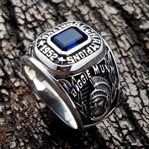 Straight-on perspective of the 1952 championship ring face resting on dark wood