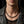Collana in pelle nera da 4 mm con terminali in argento sterling indossata da un modello
