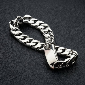 Close up of solid 925 sterling silver Cuban curb link bracelet showing polished finish and clasp