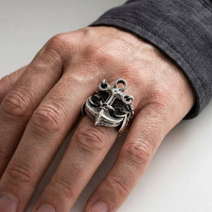 Anchor chain silver ring worn on a hand, showing the ring face and band