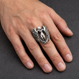 Angel Wings Sterling Silver Biker Ring worn on a middle finger in a natural hand close-up
