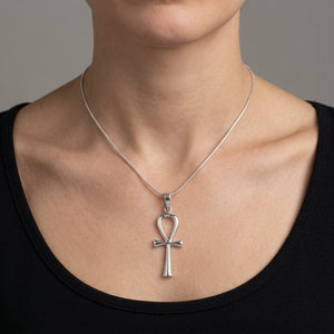 Minimal Sterling Silver Ankh Pendant, shown at the neck on an adult model; cord or chain is styling context