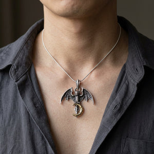 Vampire Bat & Crescent Moon Sterling Silver Pendant, worn on a neutral styling chain from chin down with collarbones, shoulders and upper chest visible; chain not included