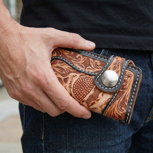 Beige Demon Skull Tooled Leather Biker Wallet, held in hand