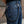 Black Braided Leather Wallet Chain with Tassels, styled between denim belt loops