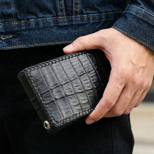 Black Crocodile Tail Leather Bifold Wallet, held in hand