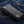 Black Gothic Cross Stingray Leather Wallet, back angled denim