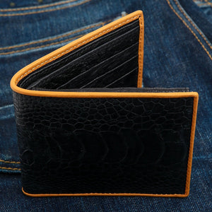 Black Ostrich Leg Bifold with Tan Trim showing front exterior with the fold partly open.
