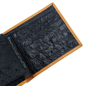 Black Ostrich Leg Bifold with Tan Trim showing quill texture and card slots on the inner panel.