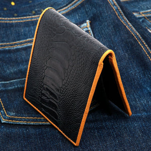 Black Ostrich Leg Bifold with Tan Trim showing opposite ostrich-leg scale panel in profile.