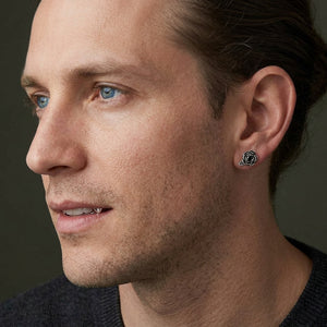 Black CZ Rose Sterling Silver Stud Earrings, worn correctly through one visible earlobe in three-quarter profile