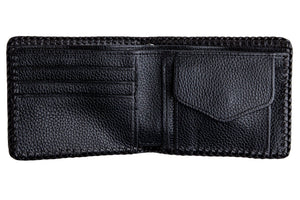 Black Shark Skin Bifold with Stingray Cross showing black interior card slots beside a covered coin pocket.