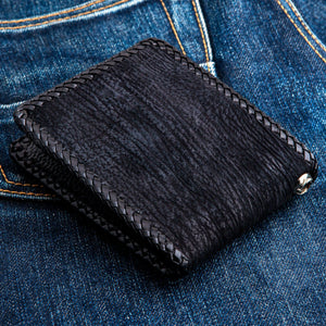 Black Shark Skin Bifold with Stingray Cross showing the plain black shark-skin reverse and braided edge.