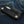 Black Stingray Cross Leather Wallet, front angled denim