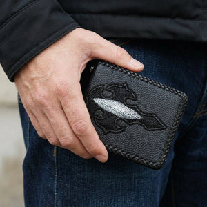 Black Stingray Cross Leather Biker Wallet, held in hand