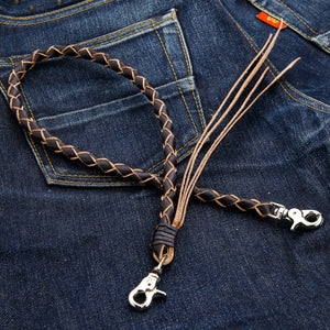 Black and Tan Braided Leather Wallet Chain, oval on denim