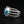 Anillo de plata esterlina con garra esquelética y ojo azul, pieza macabra de joyería con ojo; este anillo gótico muestra el dorso de la mano esquelética y sus