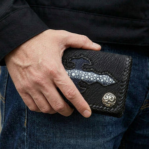 Blue Stingray Cross Shark Leather Wallet, held in hand