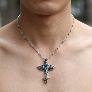 Blue Stone Winged Cross Sterling Silver Pendant, shown at the neck on an adult model; cord or chain is styling context