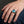 Blue Topaz CZ Scottish Lion Silver Ring, worn on one middle finger in a natural hand close-up