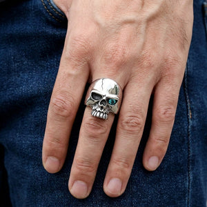 Blue Topaz-Eye Sterling Silver Skull Ring, worn on hand
