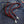 Red and black braided leather wallet chain — black clasp detail
