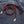 Red and black braided leather wallet chain — red clasp detail