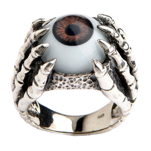 Ring i sterlingsilver med brunt öga och klor, framifrån av brunt öga mellan skelettklor