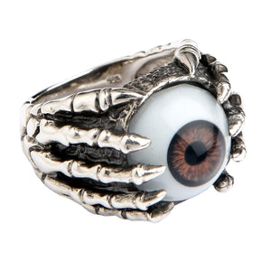 Ring i sterlingsilver med brunt öga och klor, vänster sida av skelettklor och öga
