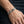 Sterling silver bulldog Cuban-link bracelet worn at a refined scale on a relaxed wrist