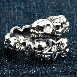 Clear CZ Star Skull Sterling Silver Ring, ring on denim left
