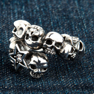 Clear CZ Star Skull Sterling Silver Ring, ring on denim right