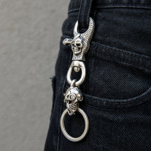 Clear-Eye Skull Sterling Silver Keychain, clipped to a black denim belt loop