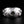 Clear Topaz Fleur-de-Lis Sterling Silver Ring. Round stone front.