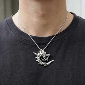 Coiled Flame Dragon Sterling Silver Pendant worn on a fine chain, showing the neck and collarbones