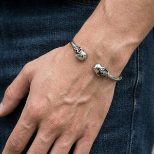 Compact Twin-Skull Sterling Silver Open Cuff, worn on an adult wrist