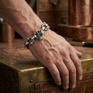 Crazy skull chain silver bracelet worn on a wrist