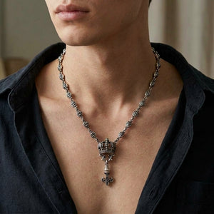 Crown and Fleur-de-Lis Sterling Silver Necklace, worn with the clasp hidden behind the neck