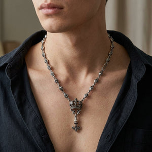 Crown and Fleur-de-Lis Sterling Silver Necklace, worn on the neck with collarbones, shoulders and upper chest visible