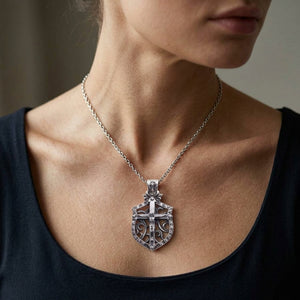 Crucifix Shield Sterling Silver Pendant worn at the neckline