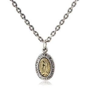 Guadalupe medal suspended from a styling chain with the skull medal behind