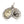 Three-quarter view of the Guadalupe and sugar skull medals overlapping