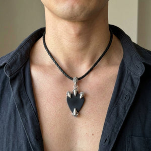 Dragon Claw Sterling Silver Guitar Pick Holder Pendant, worn on the neck with collarbones, shoulders and upper chest visible