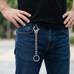 Small dragon claw silver keychain with four full claw links, worn on a jeans belt loop