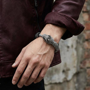 Sterling silver dragon bracelet worn with a burgundy leather jacket