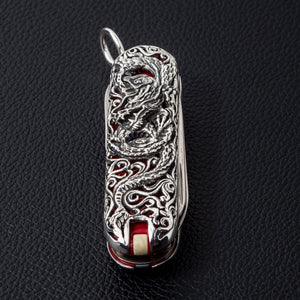 Closed dragon-engraved silver multi-tool pendant with top attachment loop