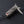 Side angle of open dragon silver multi-tool with folding tools extended